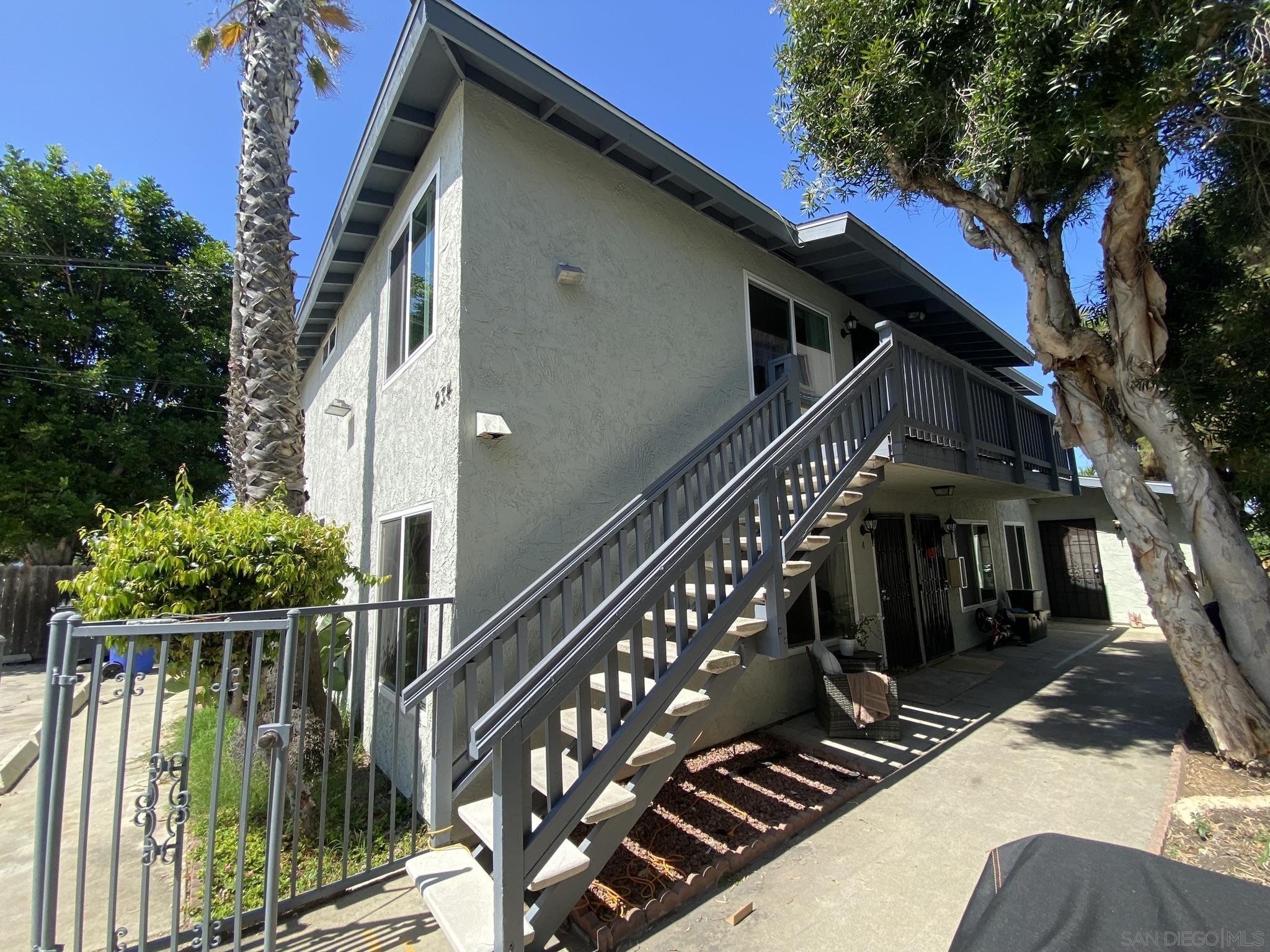 a view of a house with iron stairs