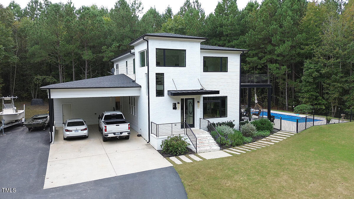 a view of house and outdoor space with swimming pool