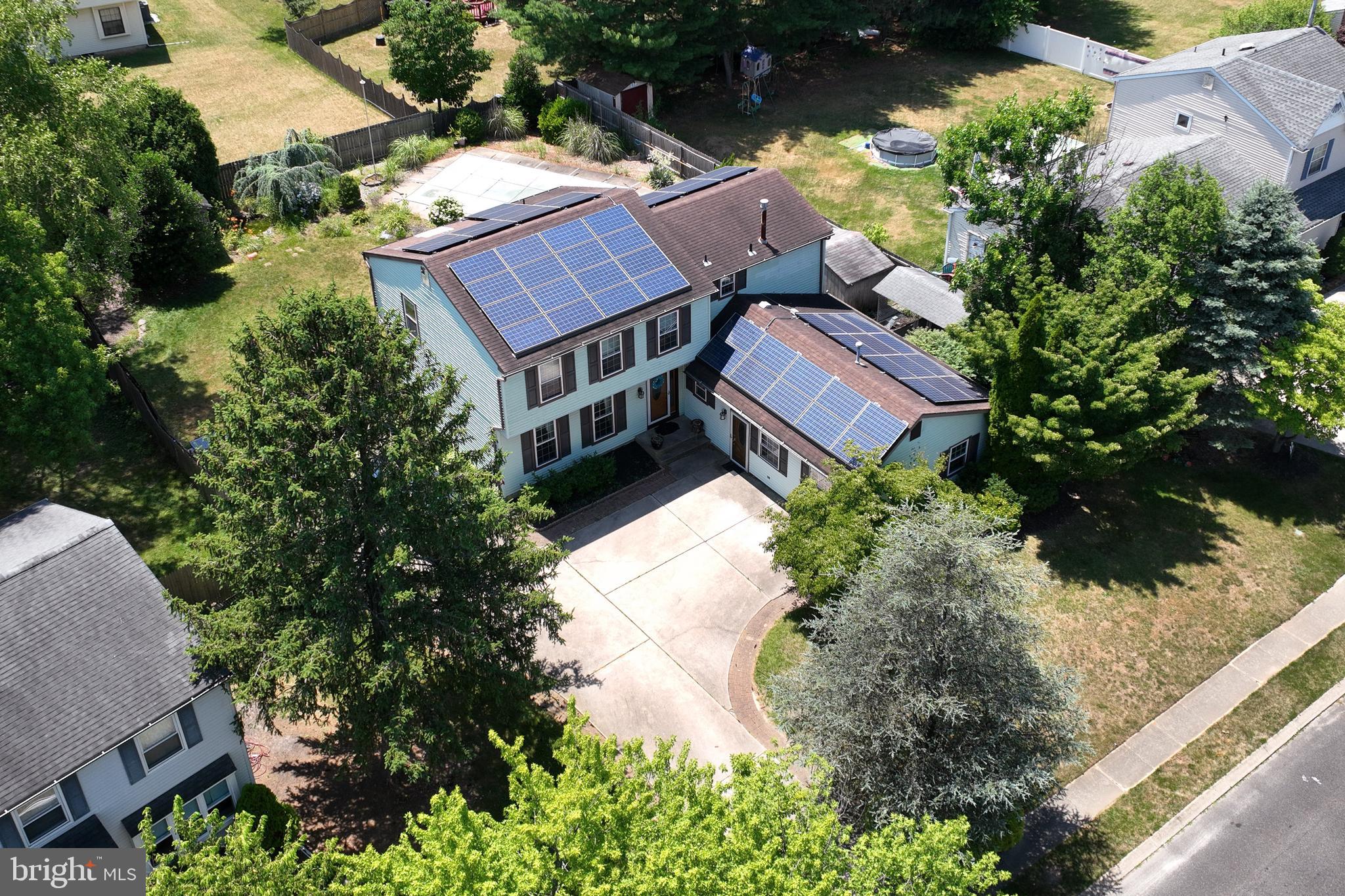 an aerial view of houses with yard