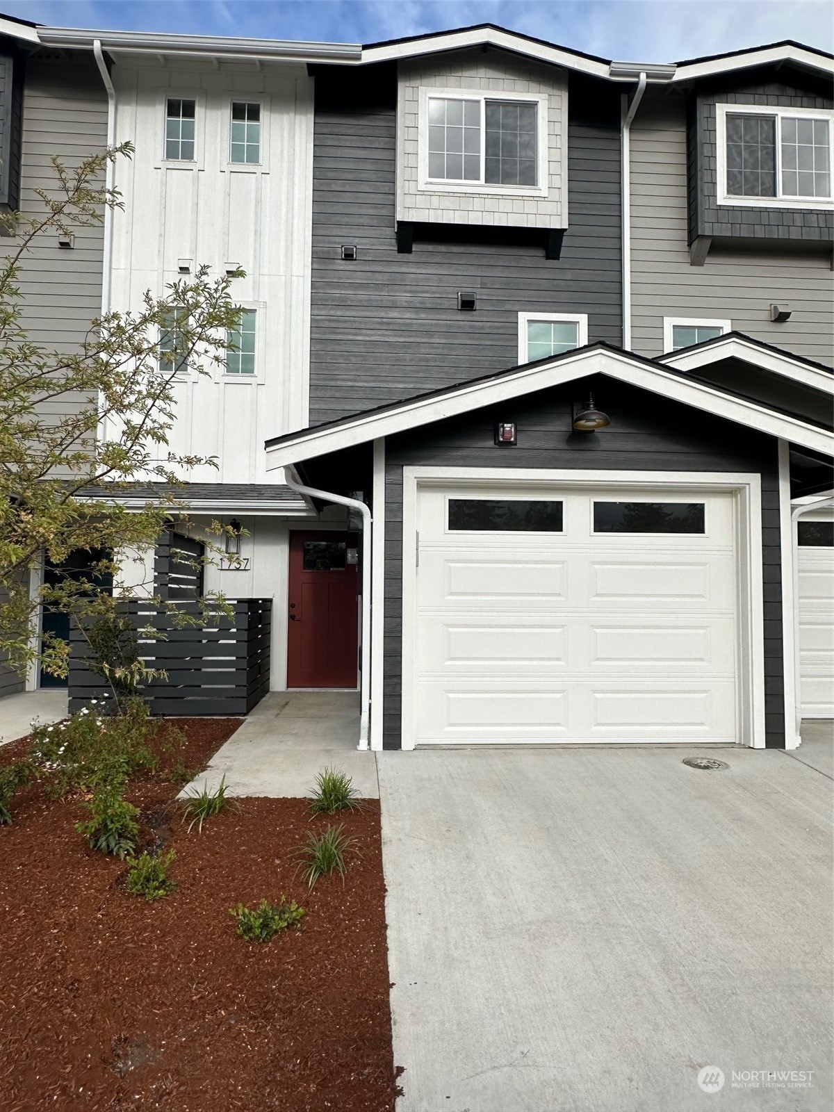 a front view of a house with a garage