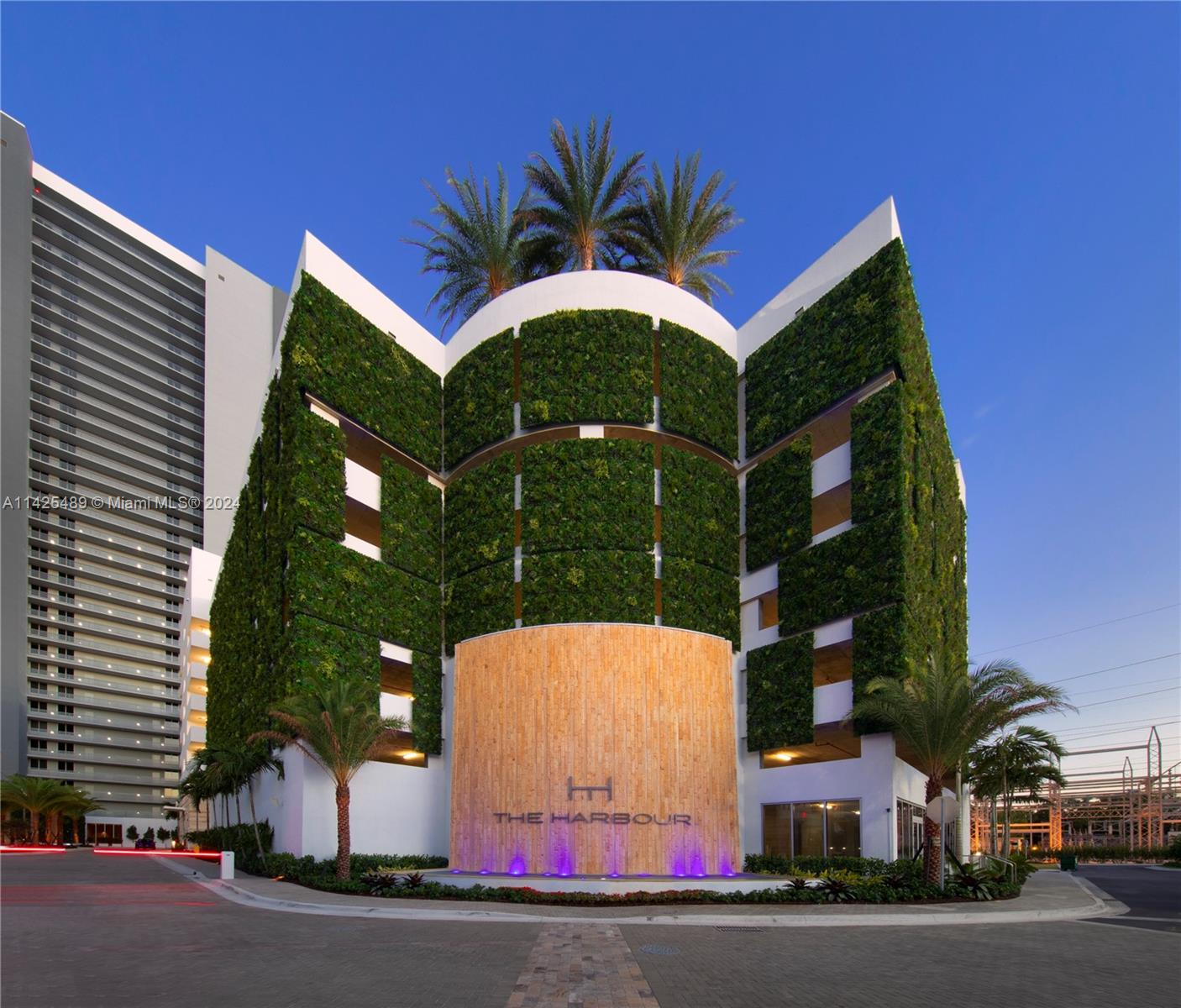 a palm tree sitting in front of a building