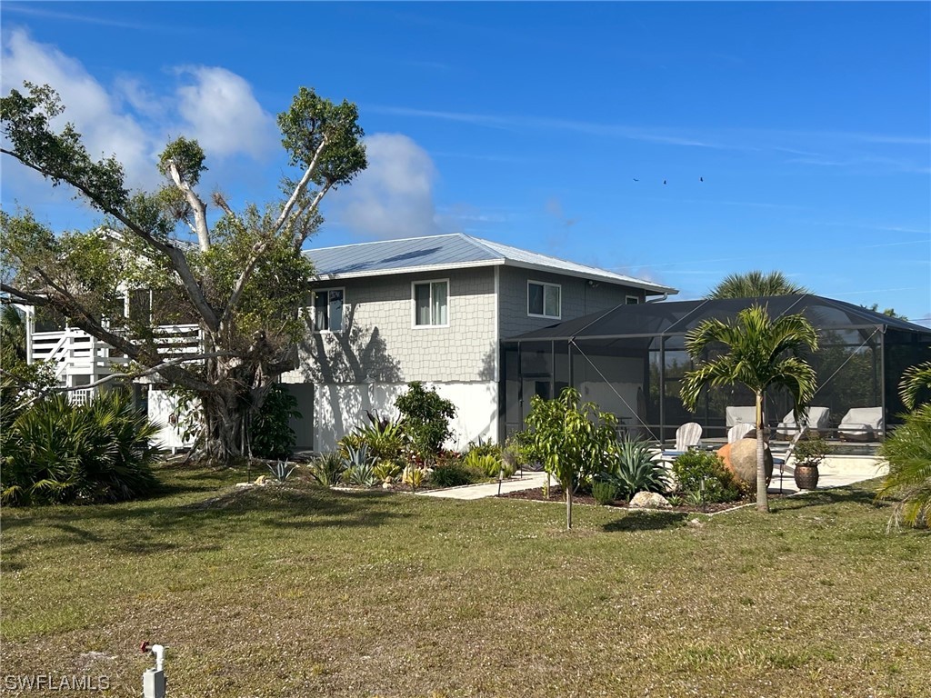 a view of a house with a yard