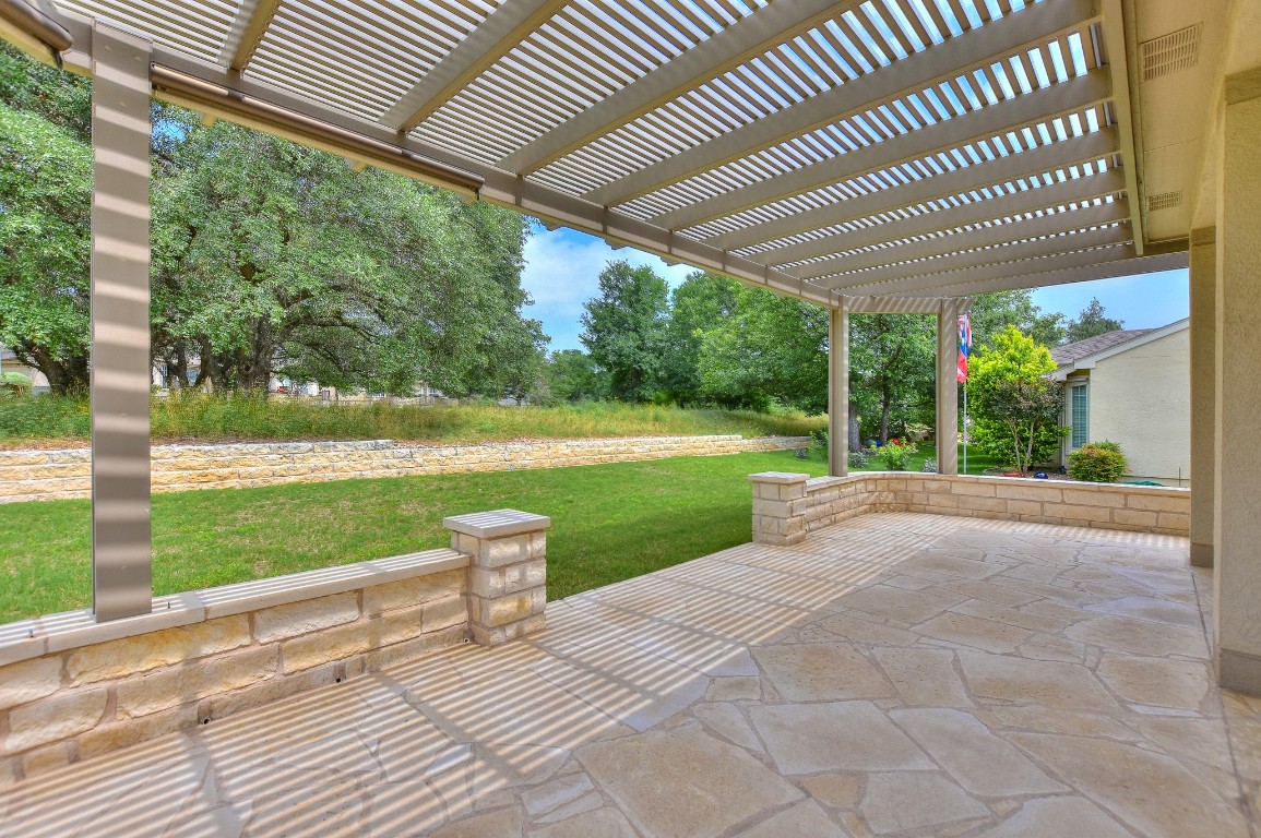 a view of a patio with a yard