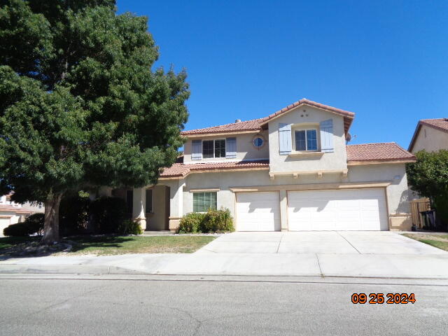 a front view of a house with a garage