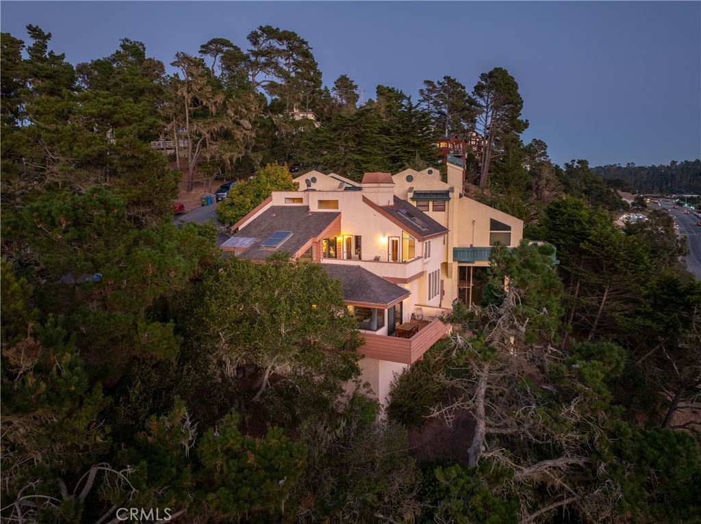 an aerial view of a house with a garden