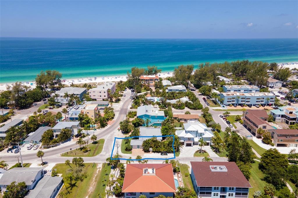 an aerial view of residential building and lake