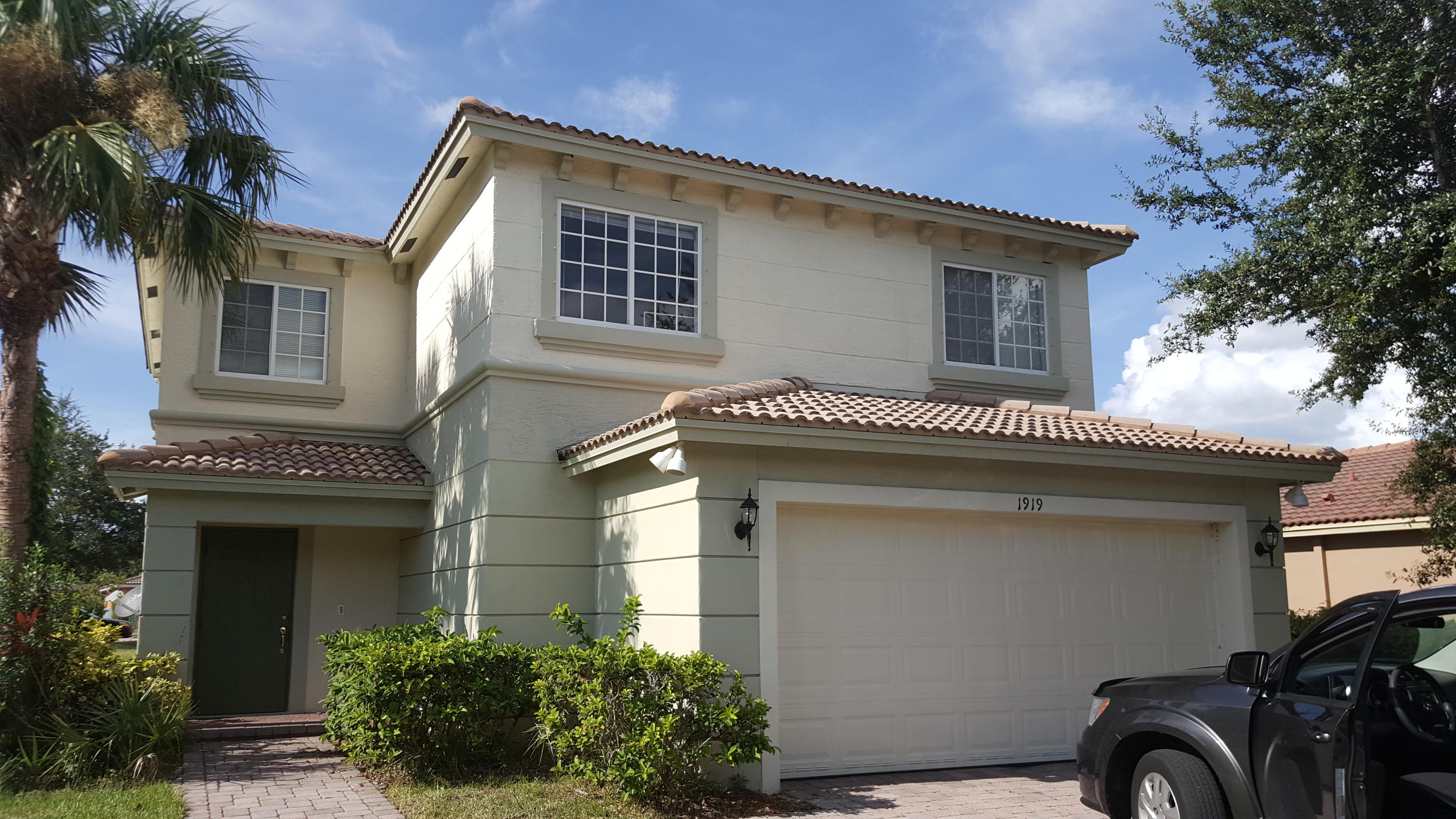 a front view of a house with a garage