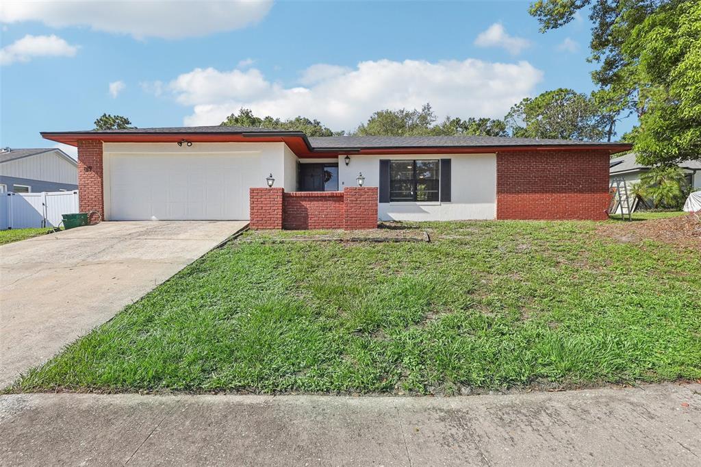 front view of a house with a yard