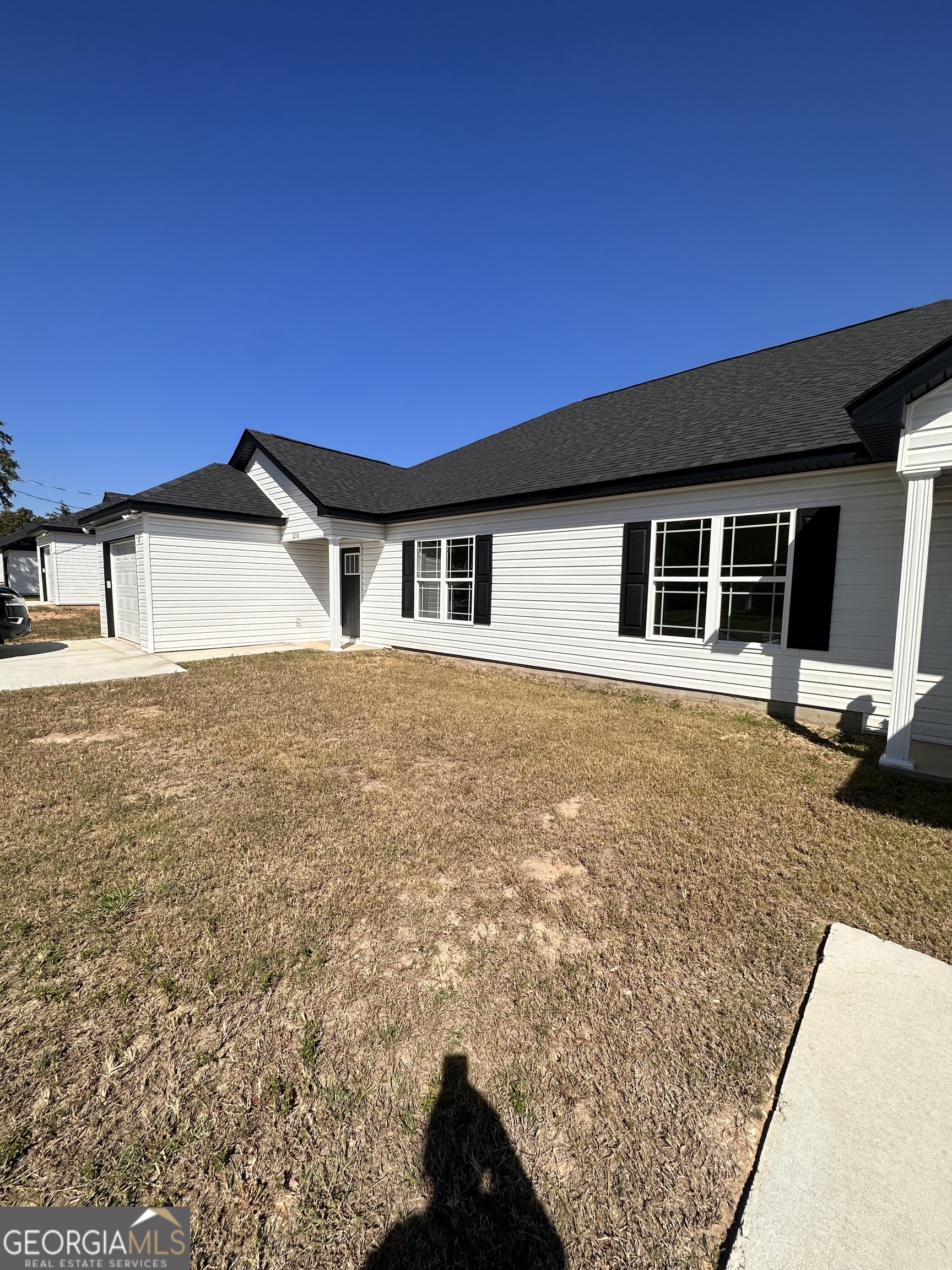 a view of a house with a yard