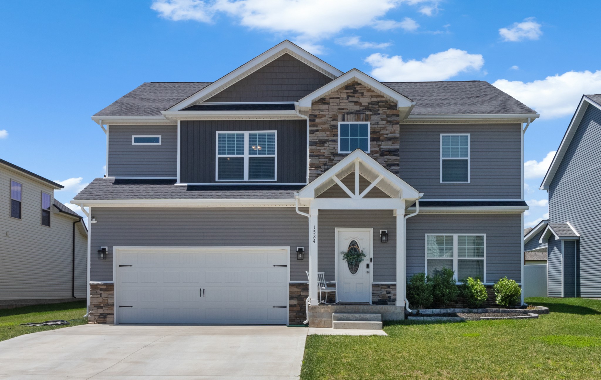 a front view of a house with a yard