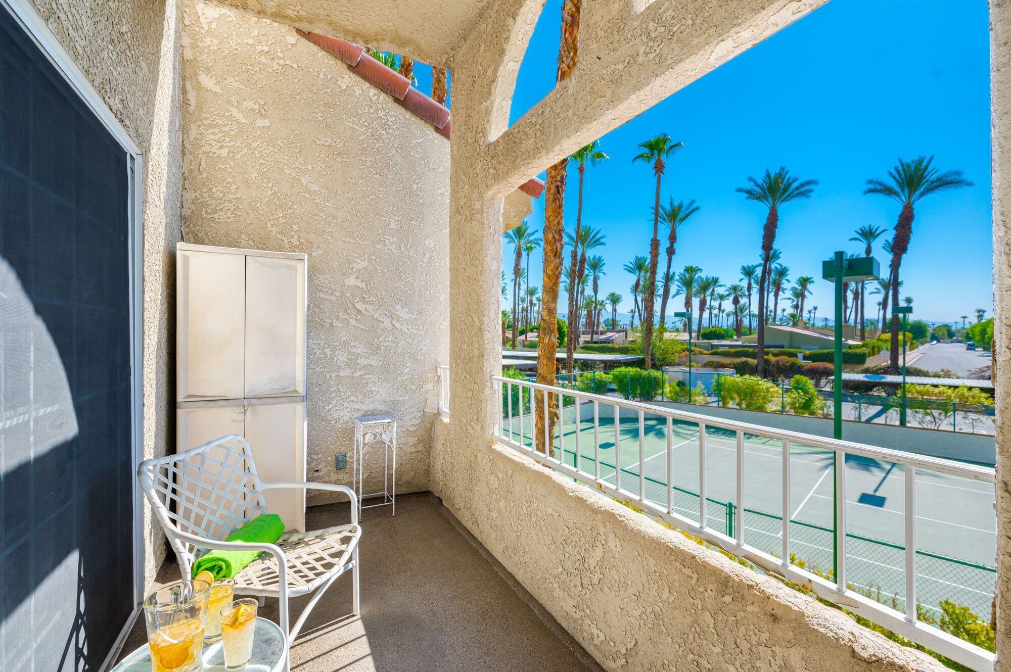 a view of balcony with furniture