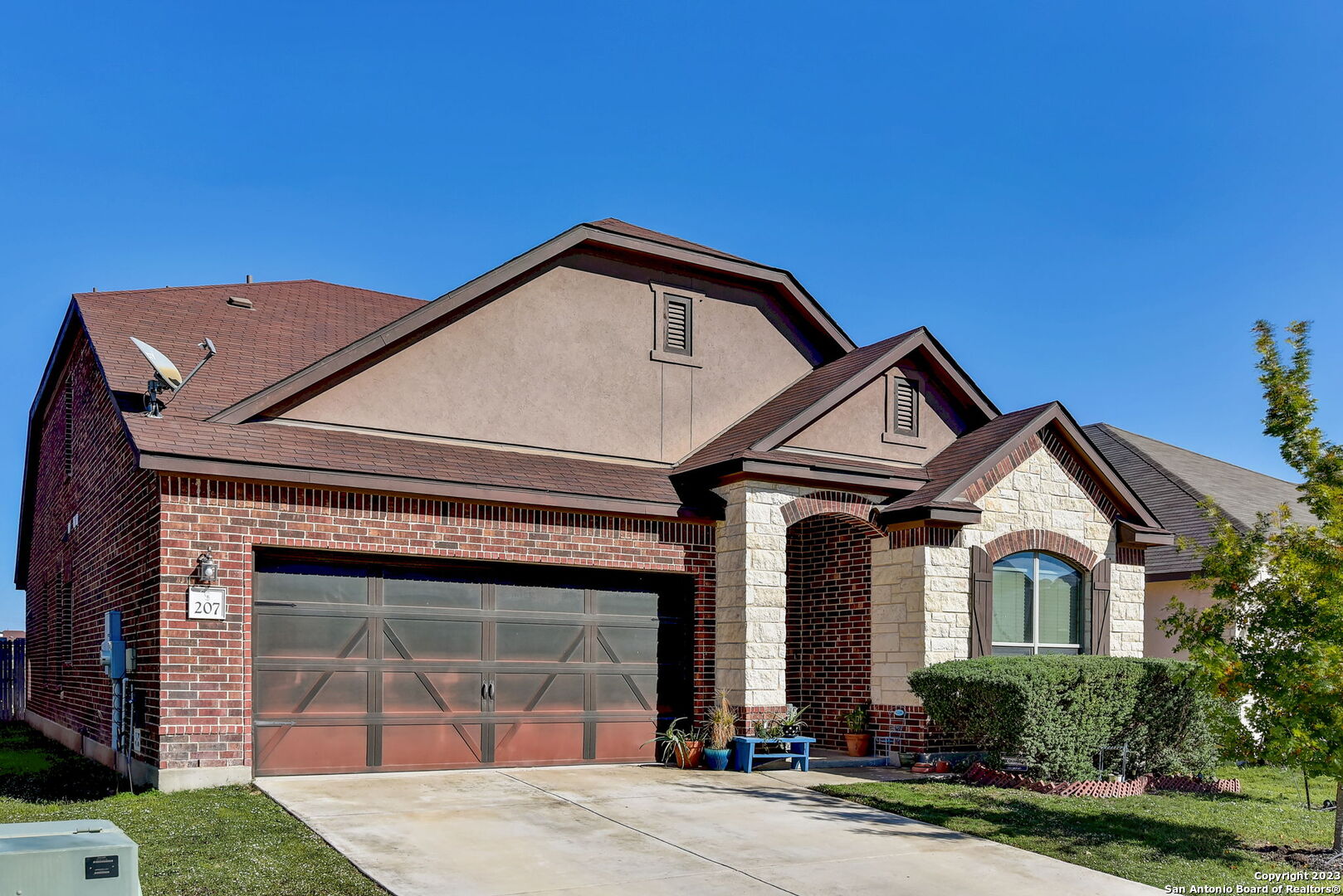 a front view of a house with garden