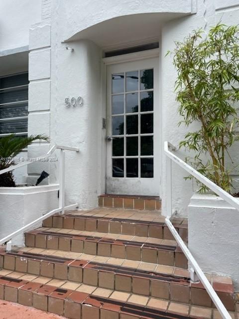 a view of balcony with a potted plant and stairs