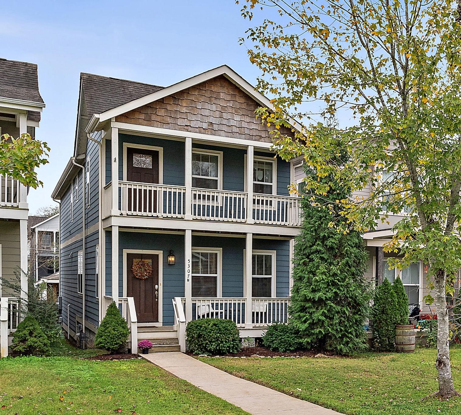 front view of a house with a yard