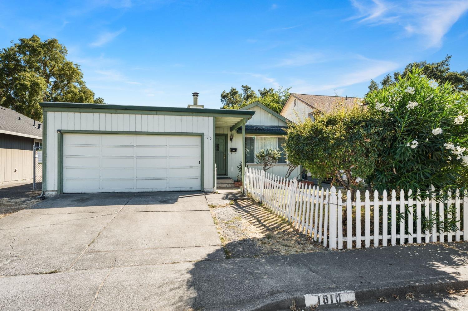 a front view of a house with a garage