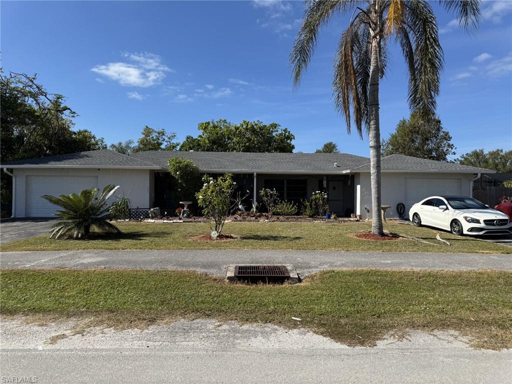 a front view of a house with garden and porch