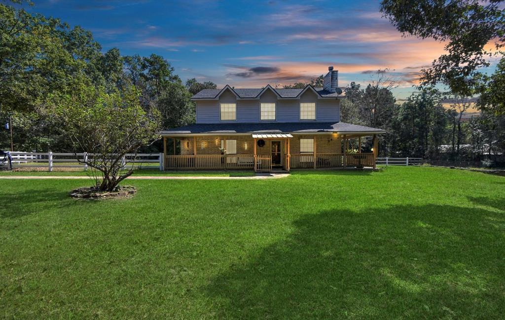 a view of a house with a big yard