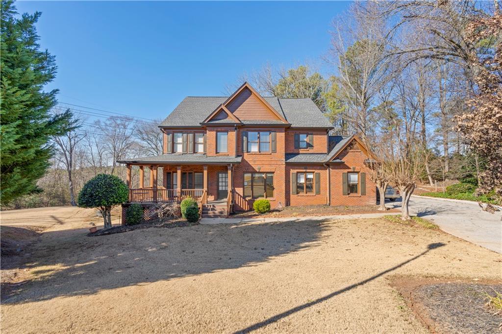 a front view of a house with a yard