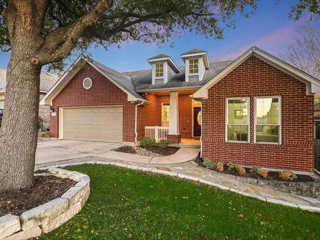 a front view of a house with a yard