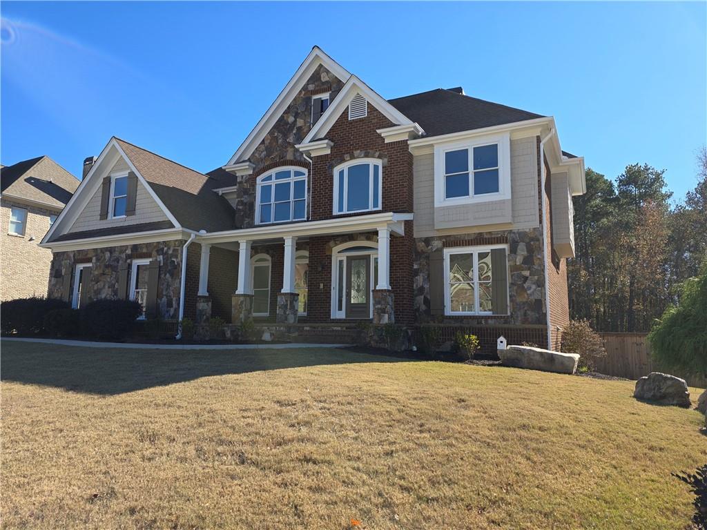 a front view of a house with a yard