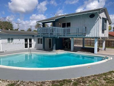 a view of house and outdoor space with swimming pool