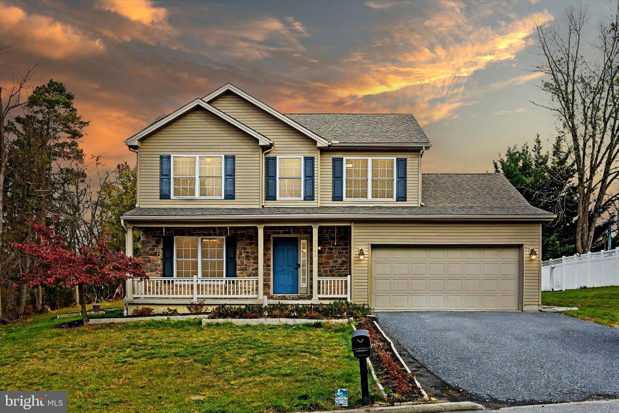 front view of a house with a yard