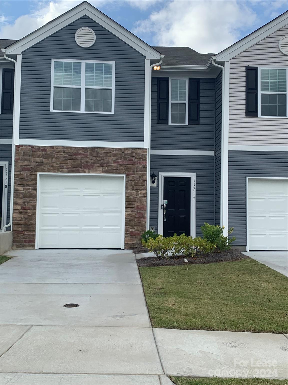 a front view of a house with garage