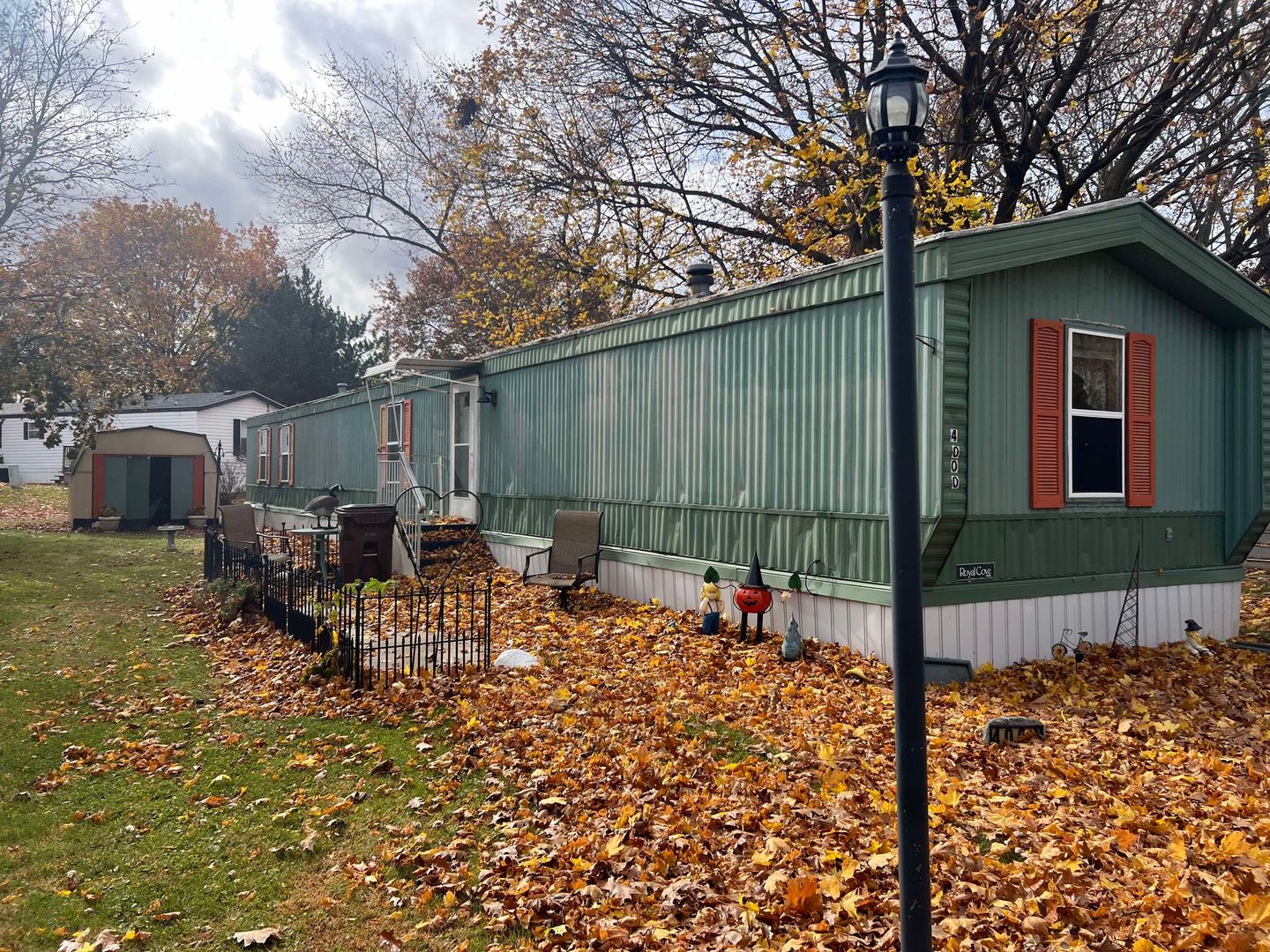 a backyard of a house with table and chairs