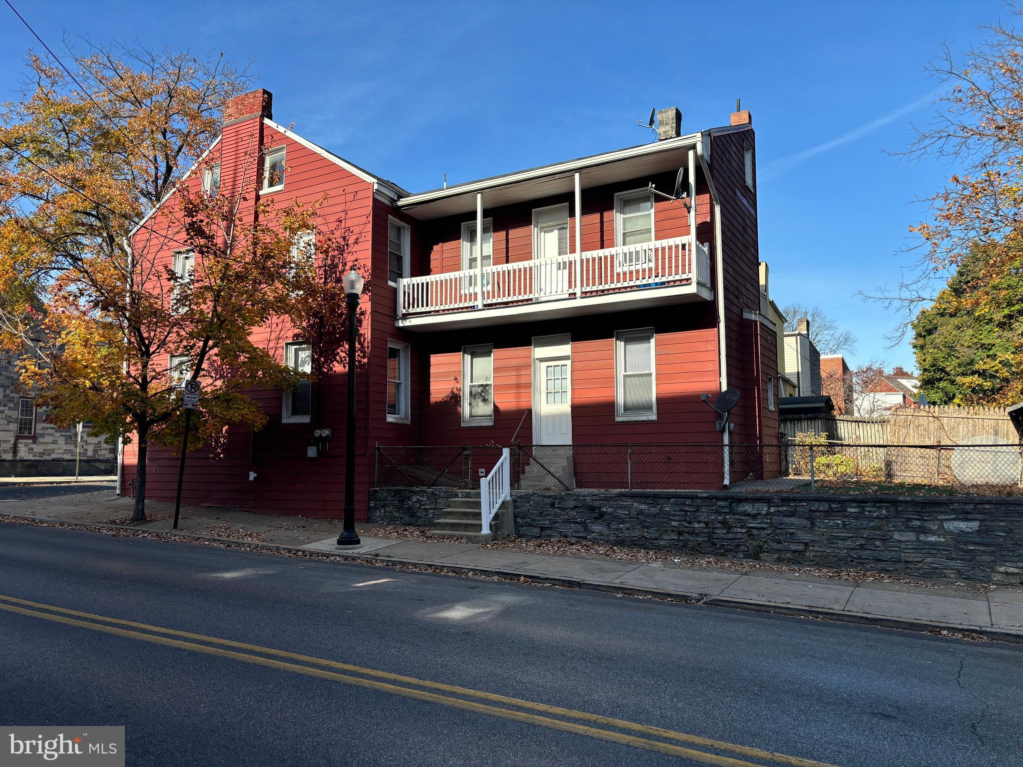 a front view of a house with large windows