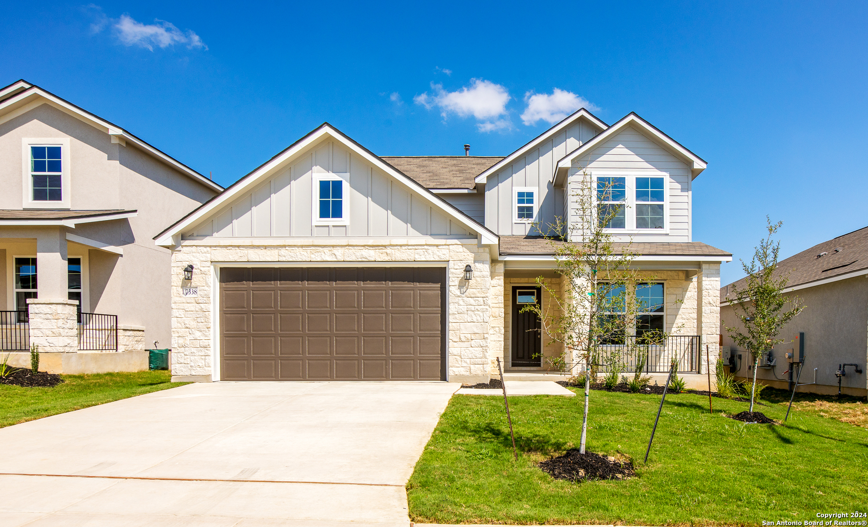 a front view of a house with a yard