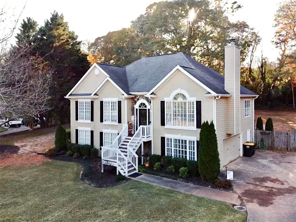 a front view of a house with a yard