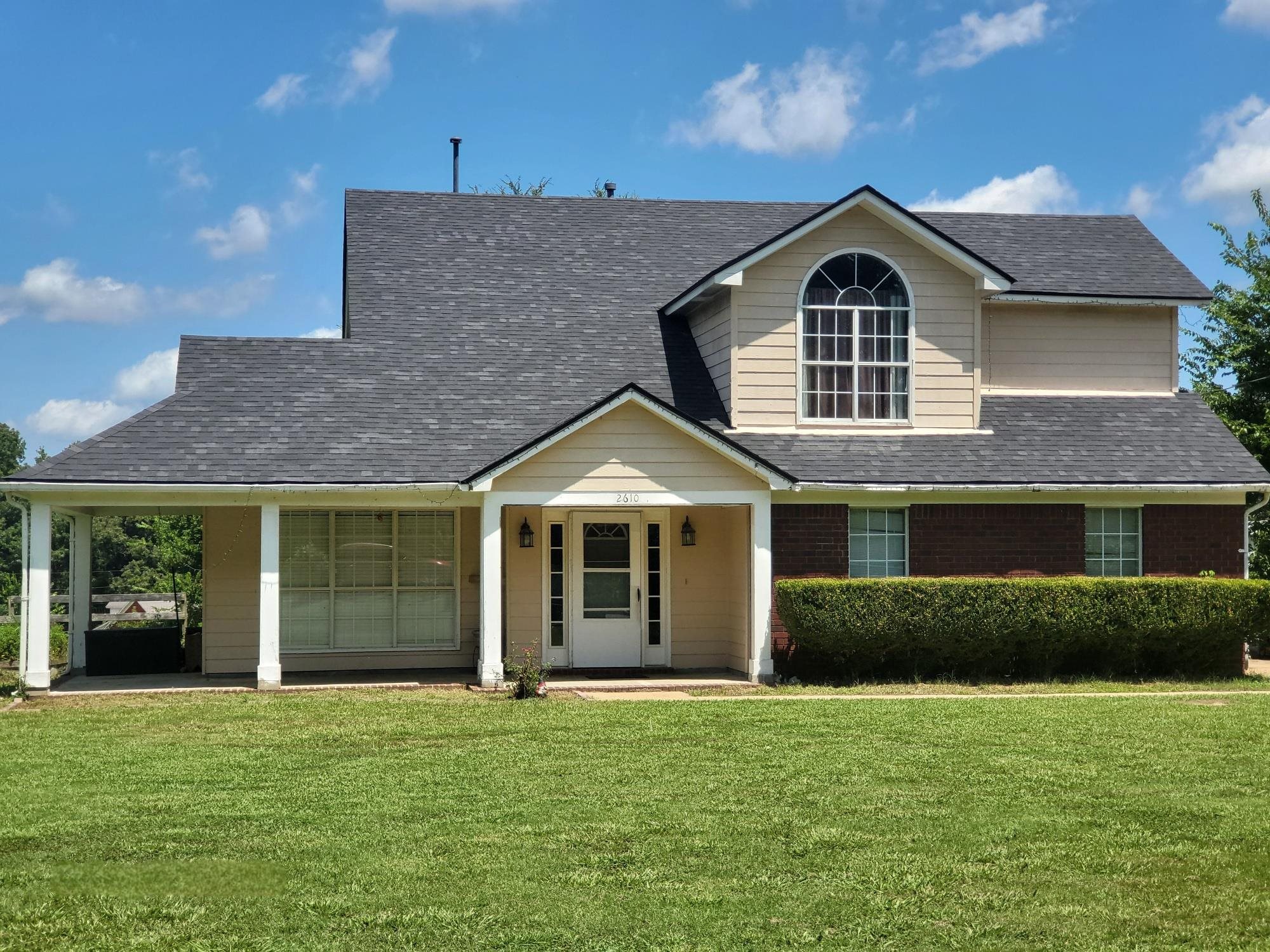 a front view of a house with a yard