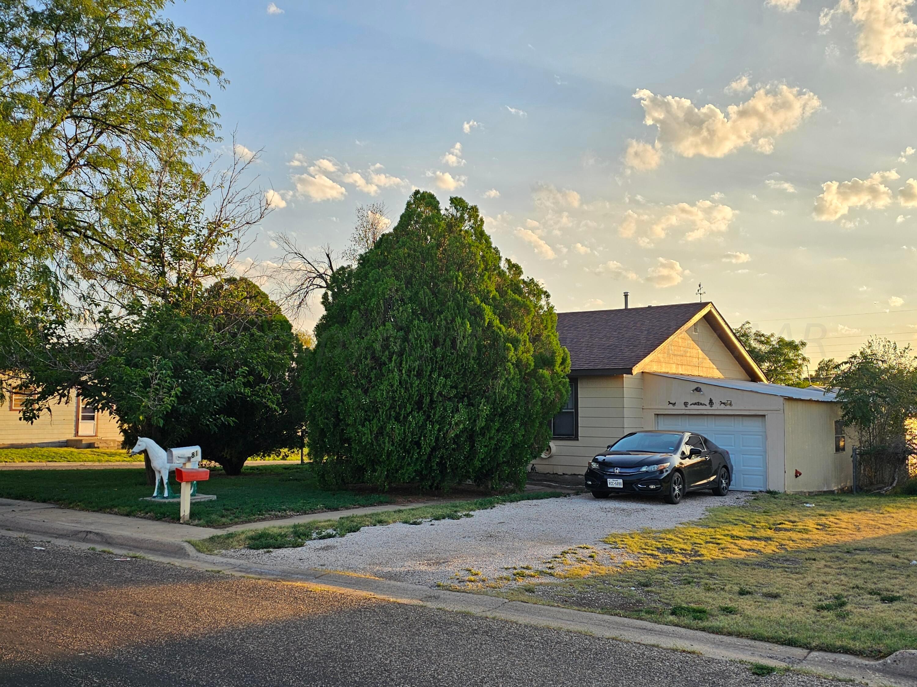 a view of road with house in background