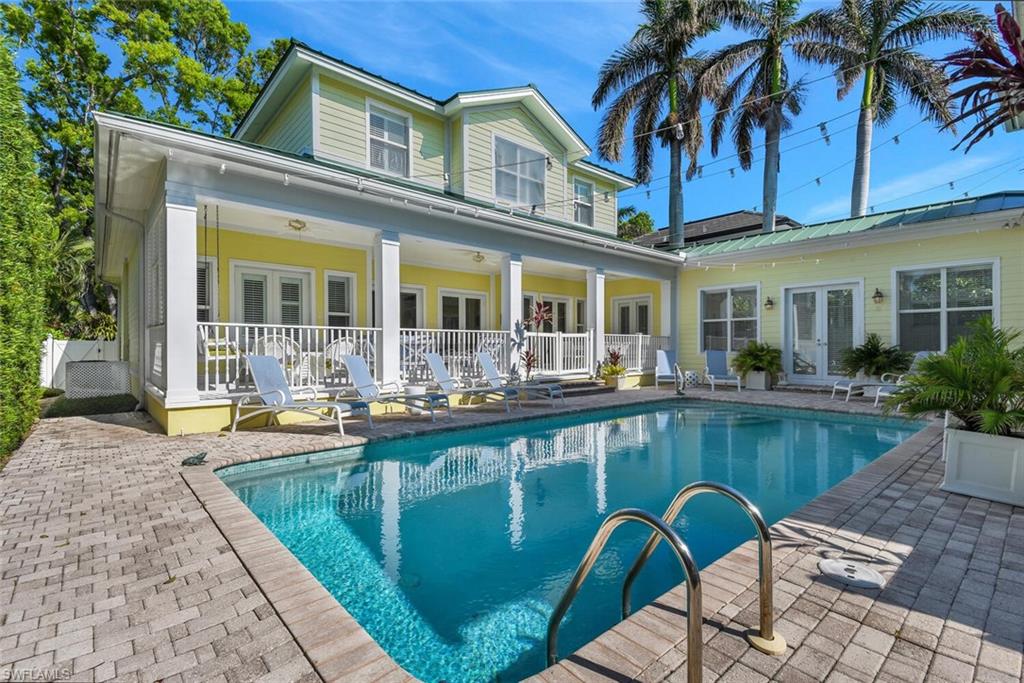 a view of a swimming pool with a lounge chairs