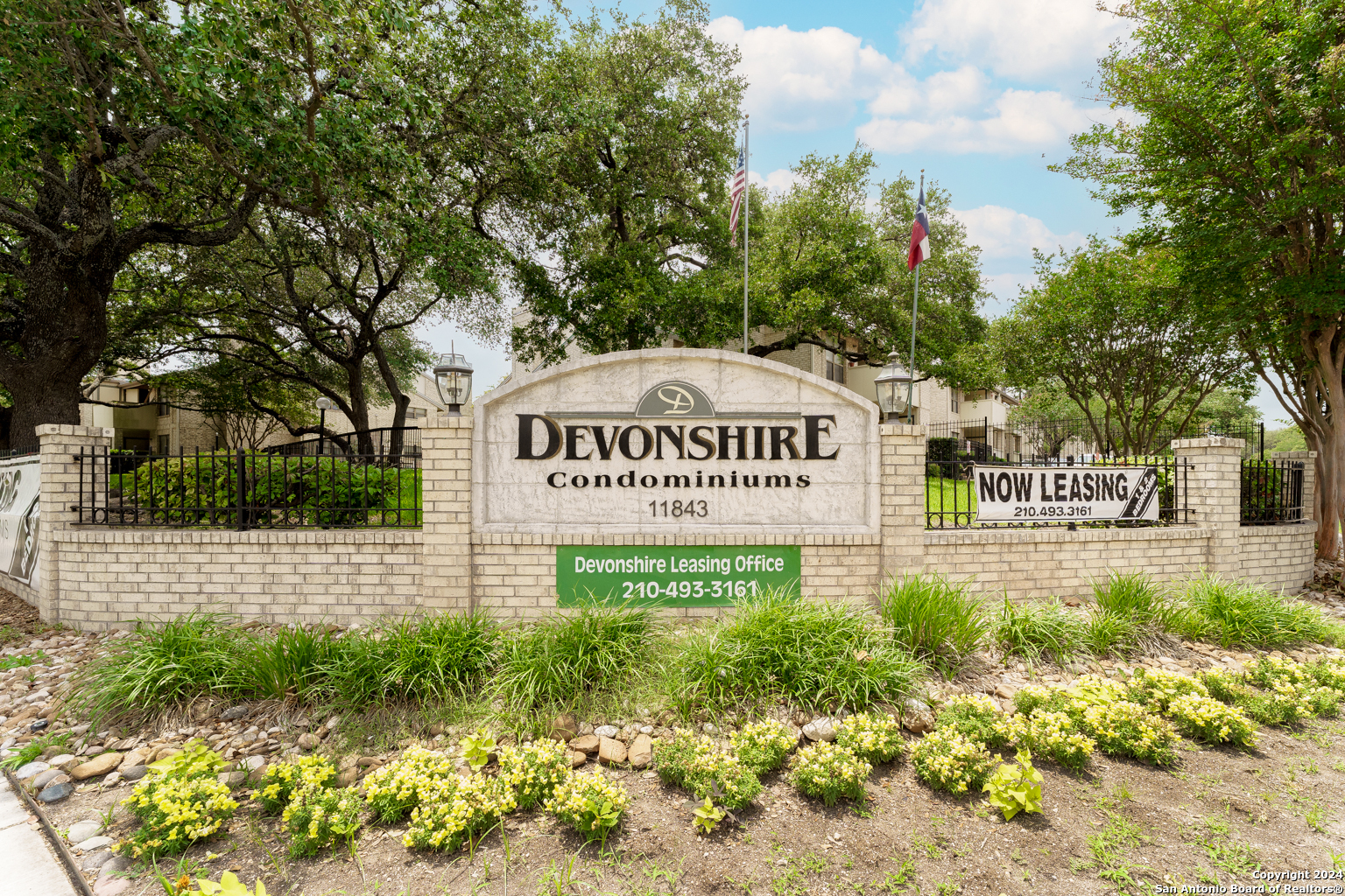 a view of a sign in front of house