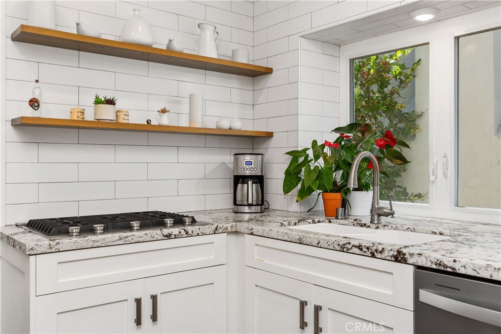 a kitchen with a stove and cabinets