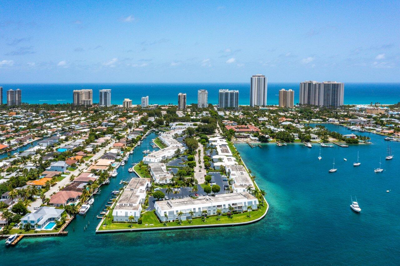 a large body of water with a large building in the background