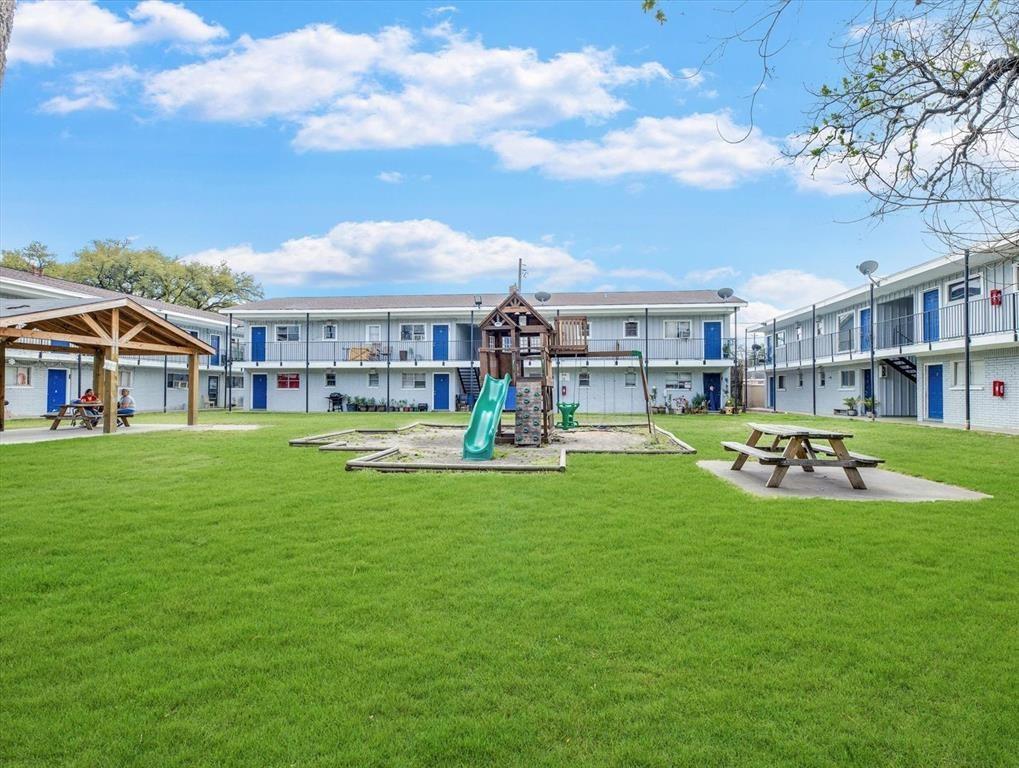 a view of a house with a yard patio and swimming pool