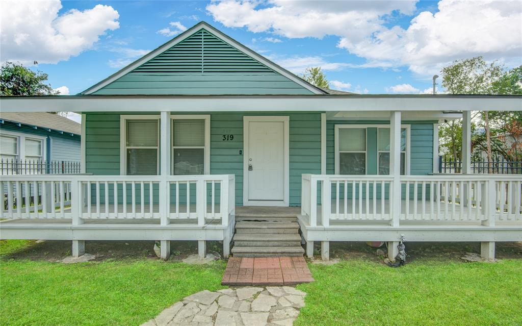 a front view of a house with a deck