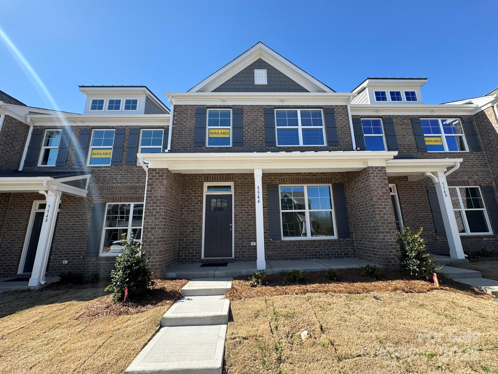 a front view of a house with yard