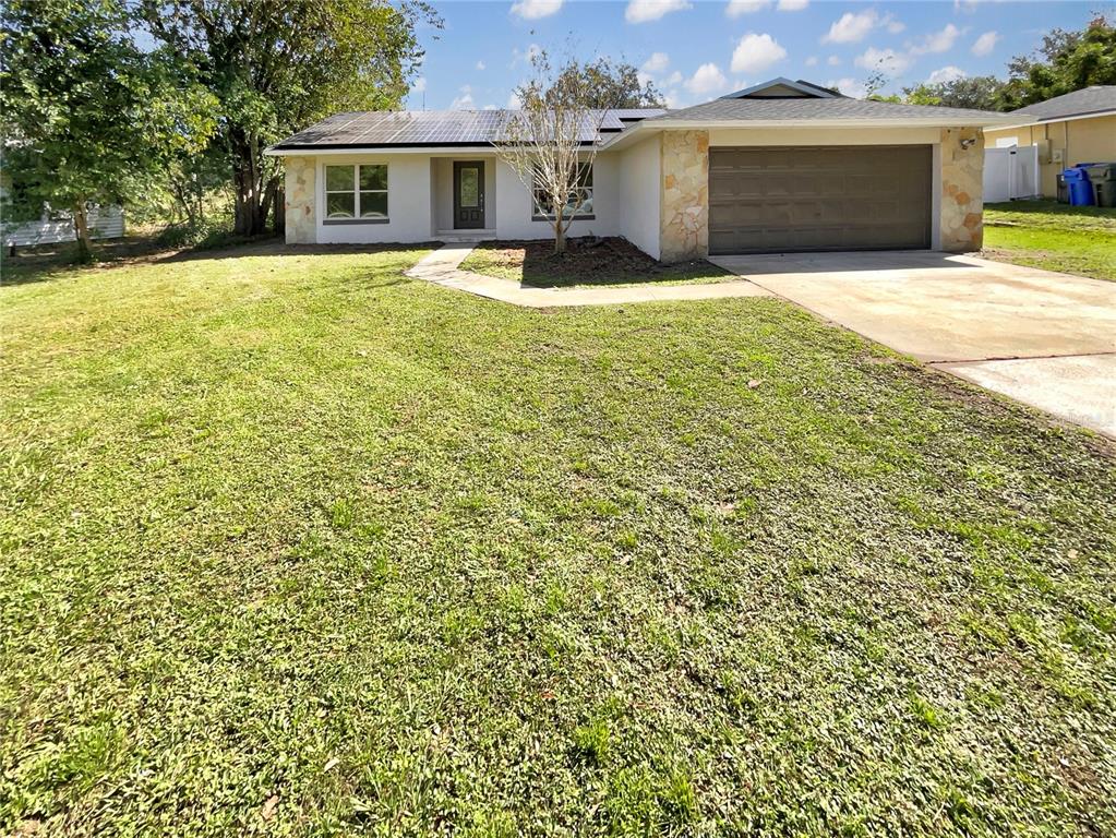 a front view of a house with yard