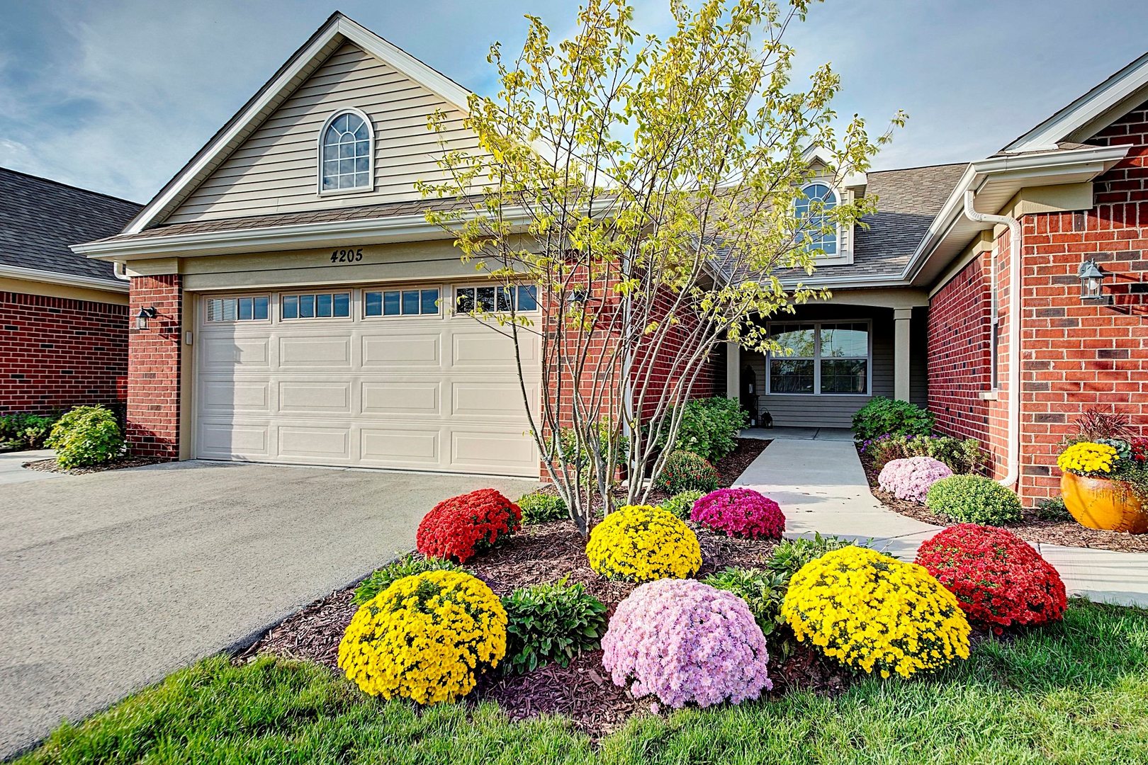 a front view of house with yard and outdoor seating