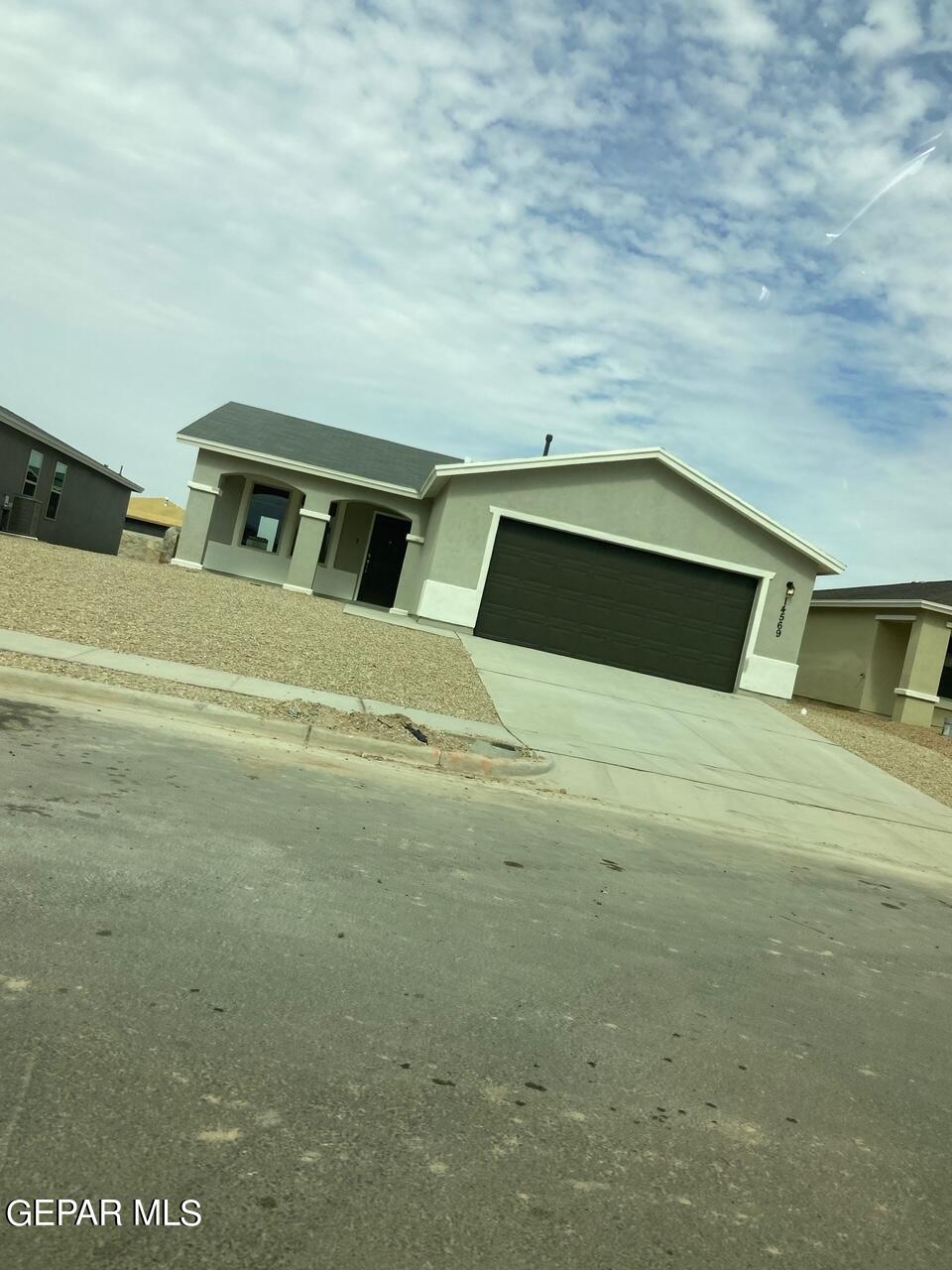 a view of a car garage of a house