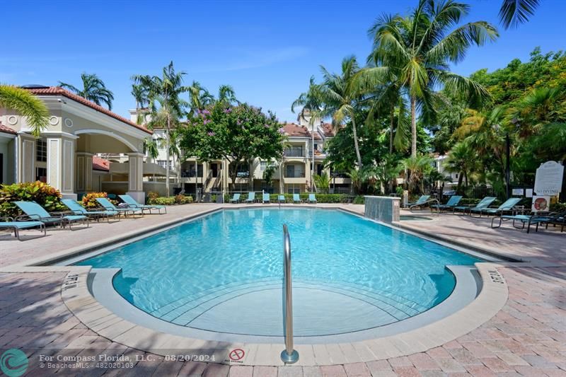 a view of a swimming pool with a patio