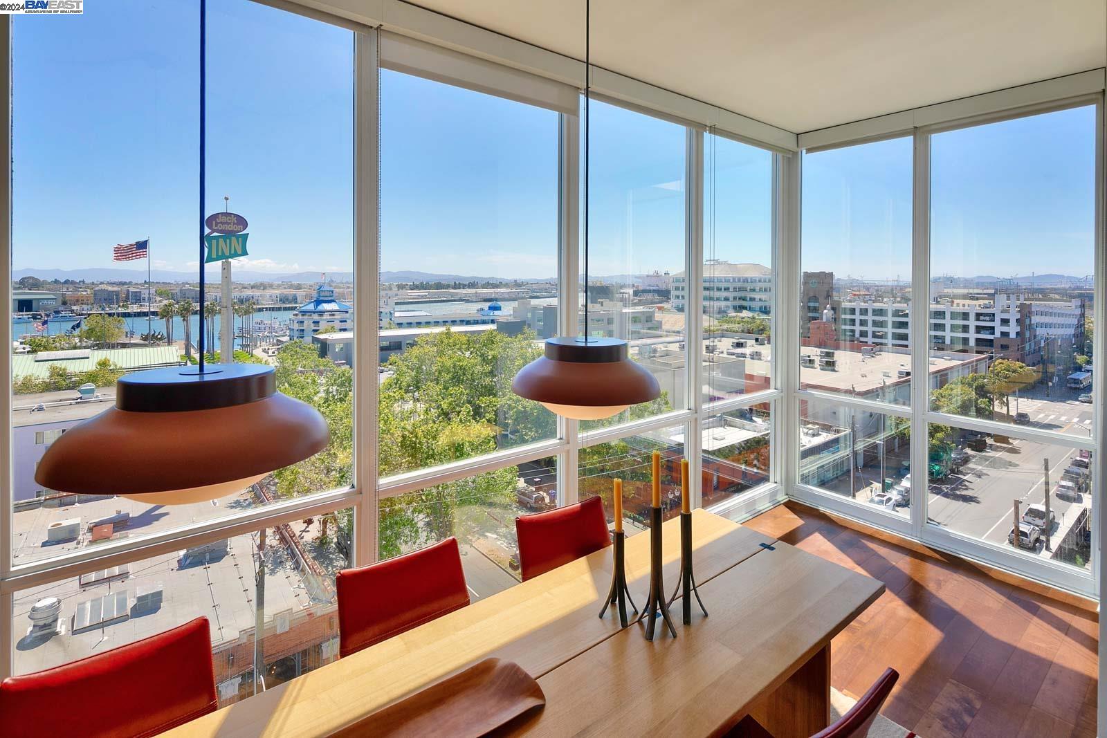 a view of living room with furniture and a floor to ceiling window