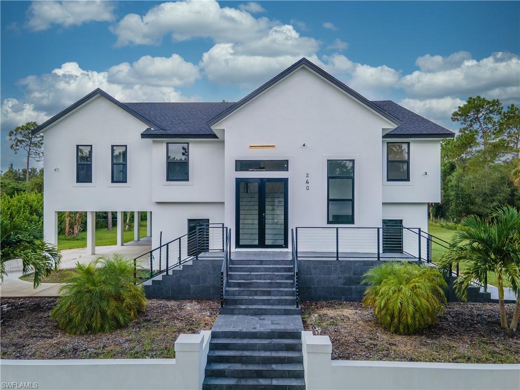 a front view of a house with garden