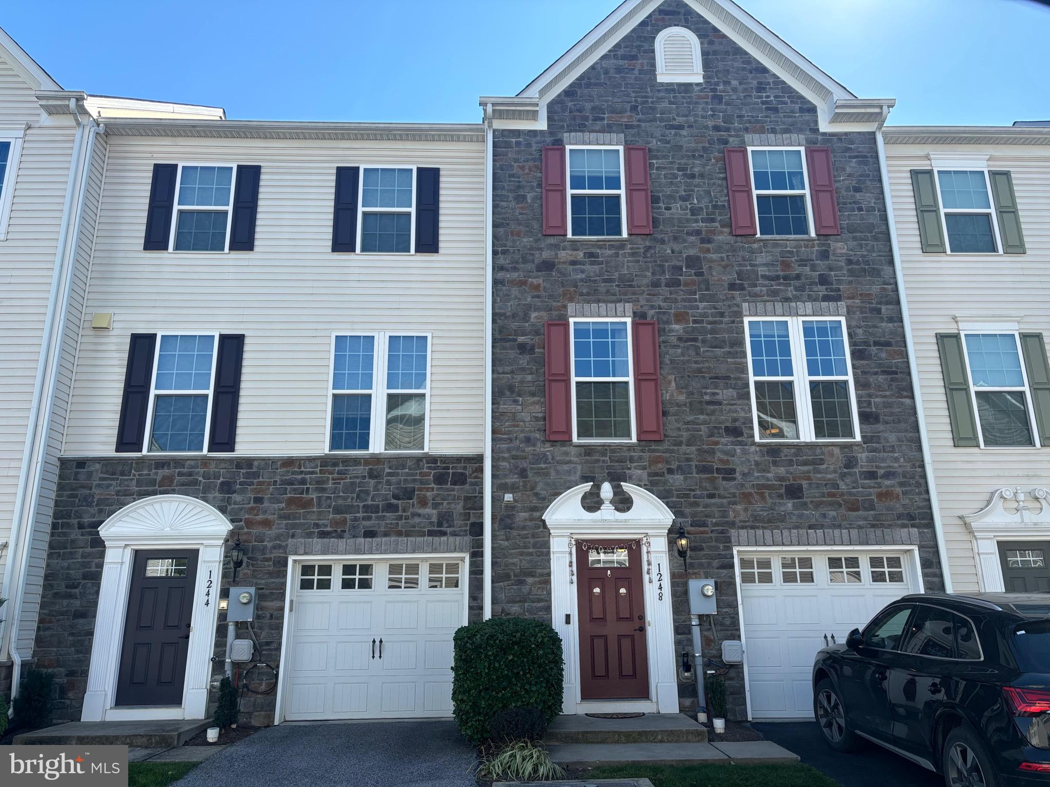 a front view of a house with parking