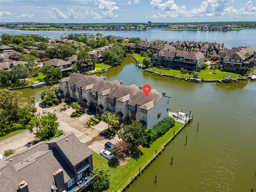 an aerial view of a house with a lake view