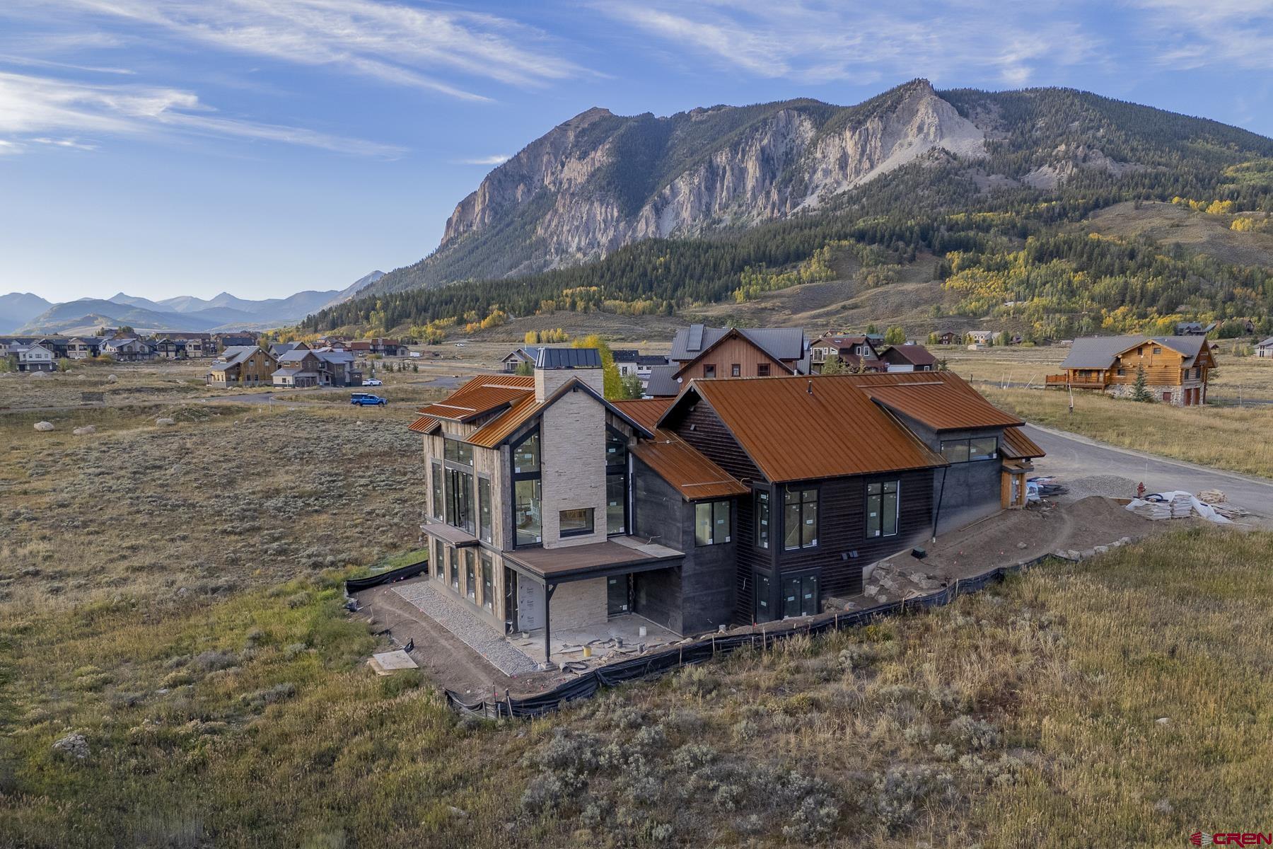 an aerial view of a house with a ocean view