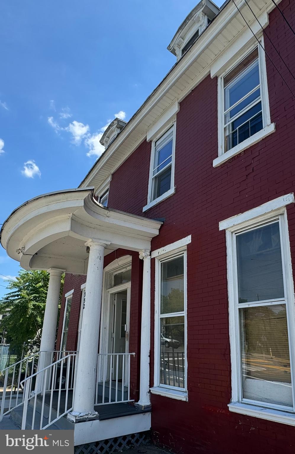 a view of a house with a door and balcony